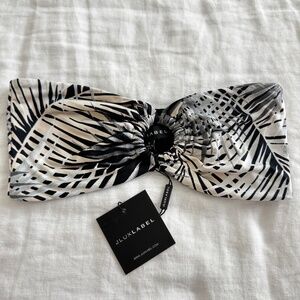 The Jlux label bandeau in size small is  new with tags attached.